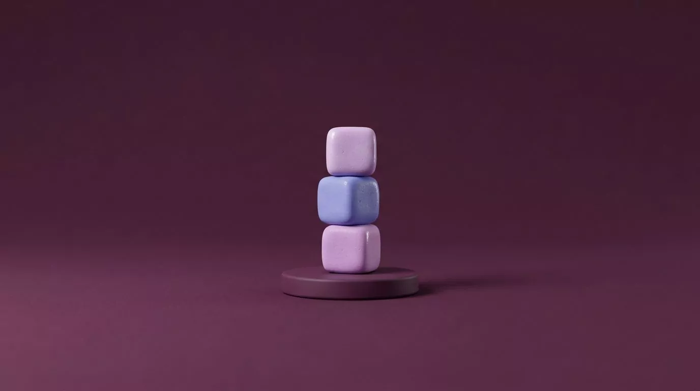 Three soft sugar cubes stacked on a podium, illustrating habit stacking for cutting back on sugar